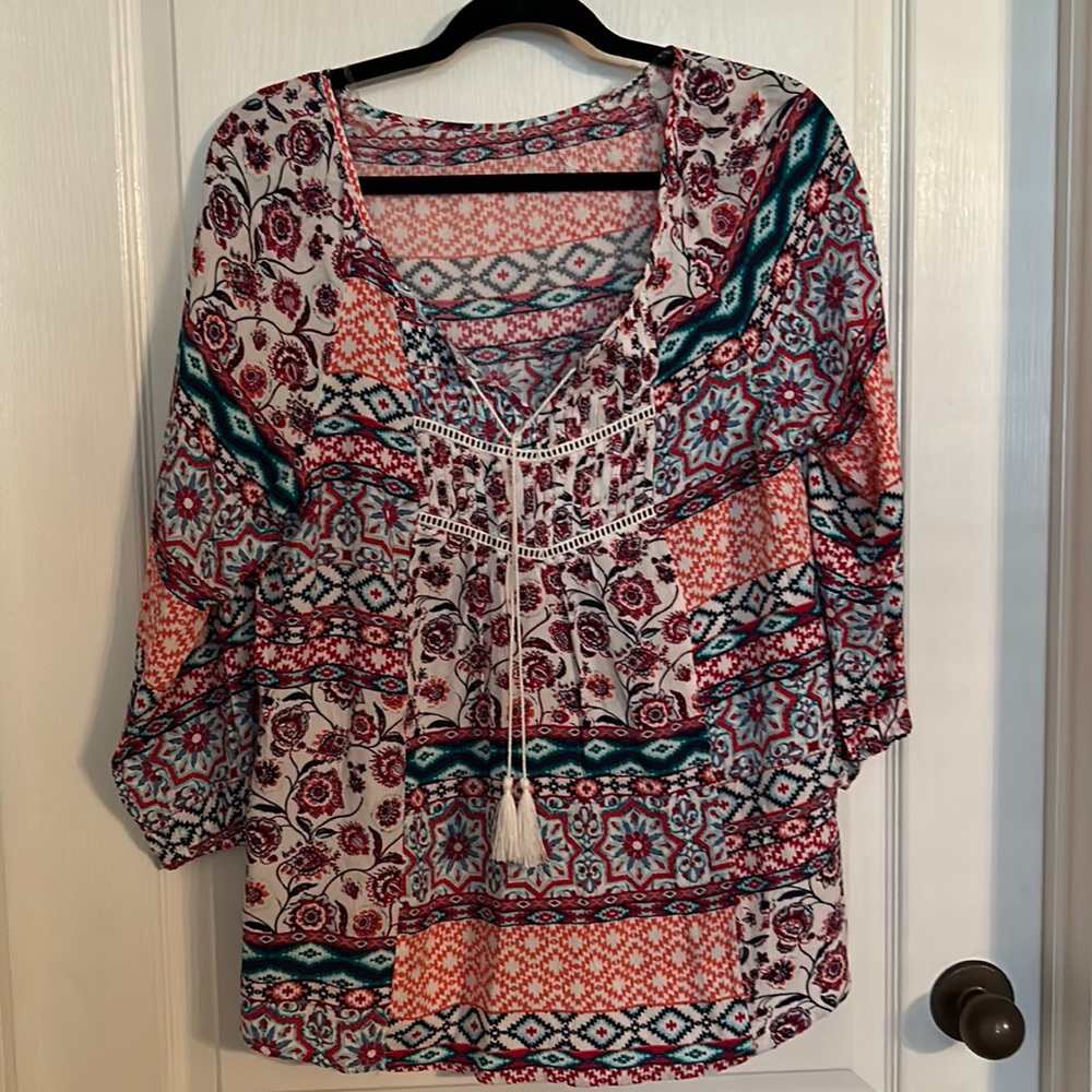 Cute shirt with detail neckline don’t know the brand never worn size medium